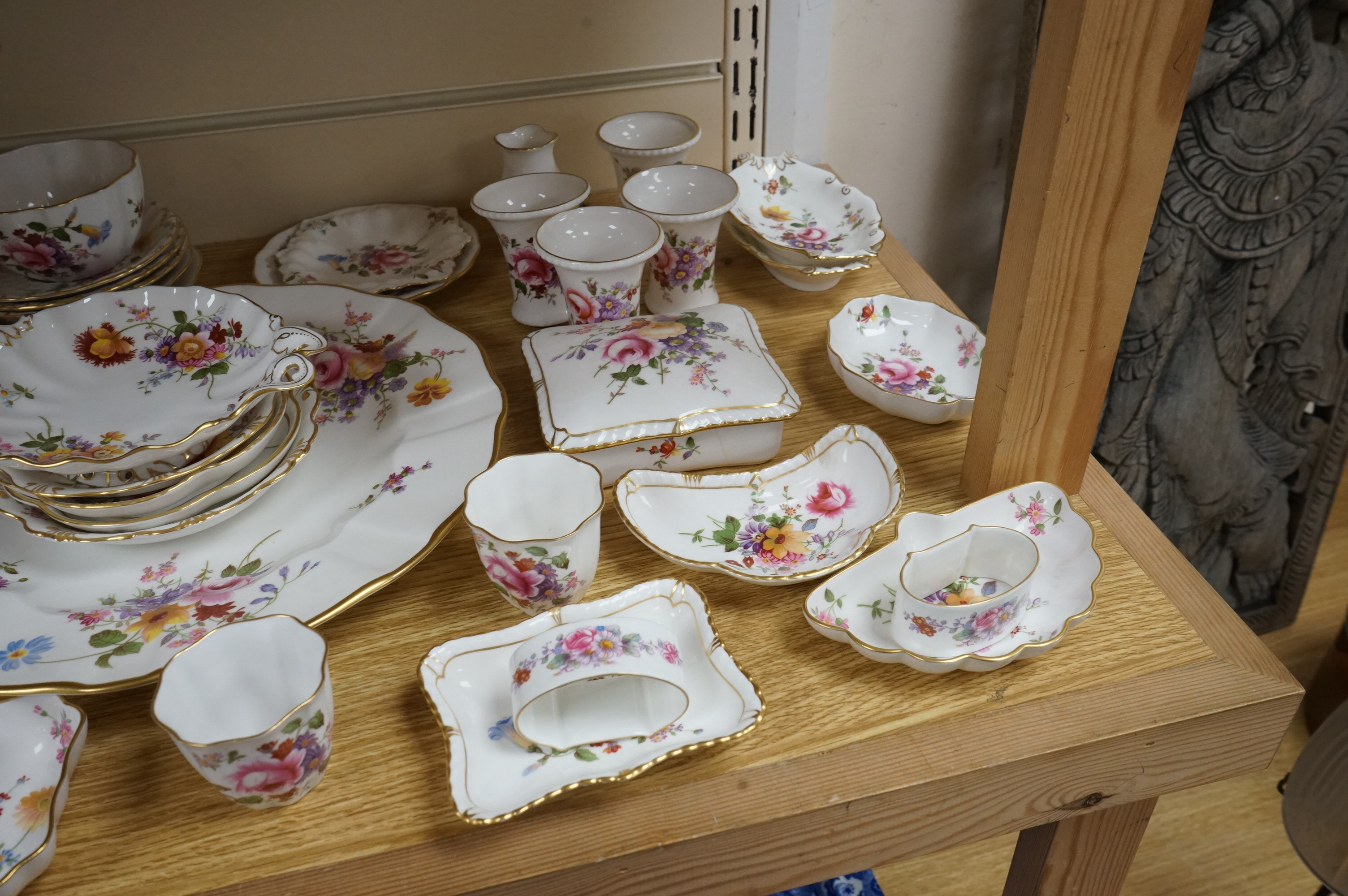 An extensive Crown Derby Posies pattern service to include trios, teapot, jugs and miniatures